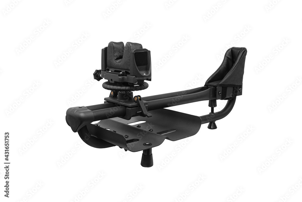 Rig for sighting weapons. Shooting rest for sighting in any rifle or shotgun. Adjustable ambidextrous recoil reducing rifle shooting rest for outdoor range. Isolate on a white back Rig for sighting weapons. Shooting rest for sighting in any rifle or shotgun. Adjustable ambidextrous recoil reducing rifle shooting rest for outdoor range. Isolate on a white back