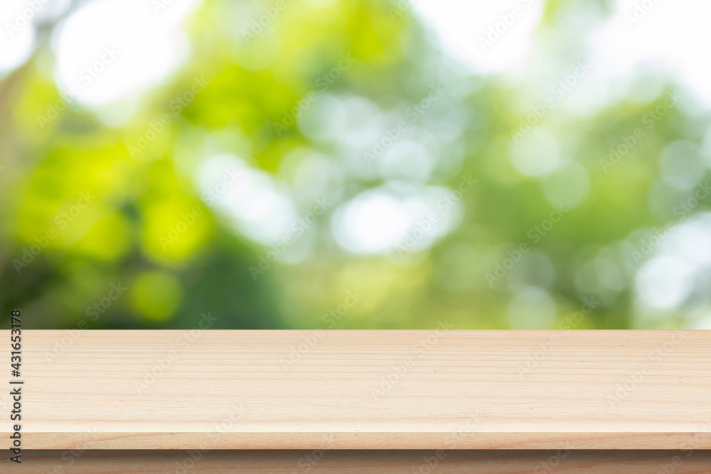 wooden table on green bokeh background wooden table on green bokeh background