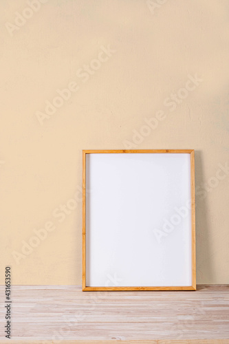 vertical wood frame mock up on wooden floor and Light brown background