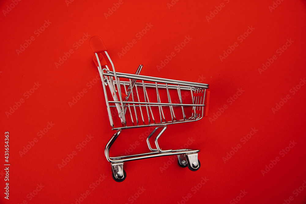 Shopping cart isolated on red Shopping cart isolated on red