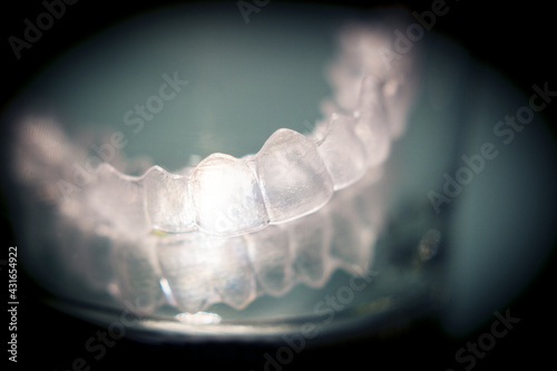 Transparent tooth aligner inside a crystal glass