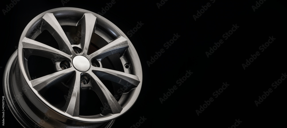 the new alloy wheel is gray on a black background. auto parts and tuning. long layout copyspace
