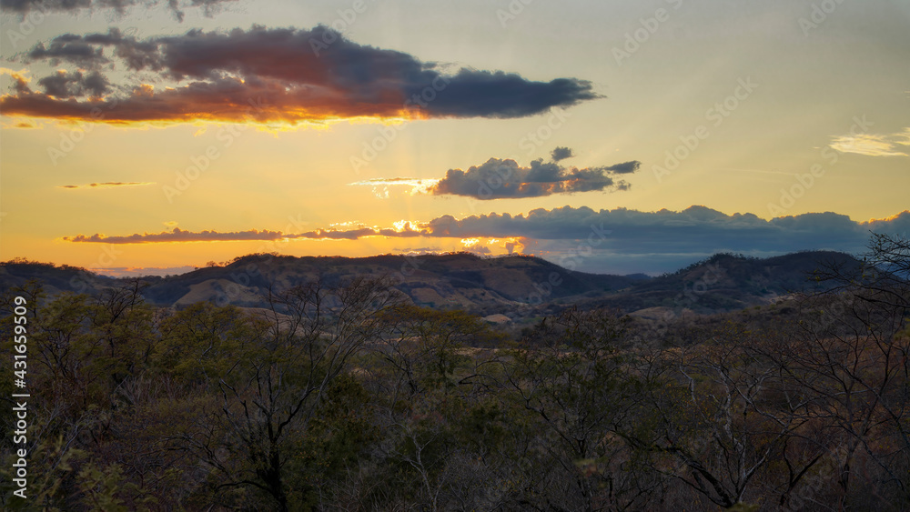 Sunset over the hills in dry landscape