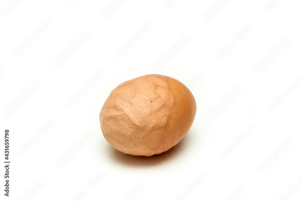 The organic egg with rough and wavy eggshell. Isolated on white background. Reason can be the old hen, insufficient nutrition or wrong process of formation of the egg. The organic egg with rough and wavy eggshell. Isolated on white background. Reason can be the old hen, insufficient nutrition or wrong process of formation of the egg.