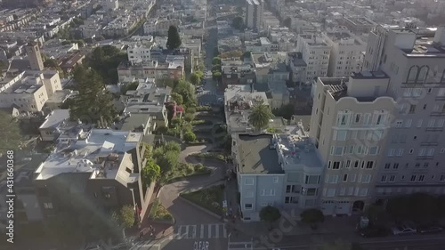 Aerial View Of Lombard Street With Cityscape And San Francisco - Oakland Bay Bridge In San Francisco, California.