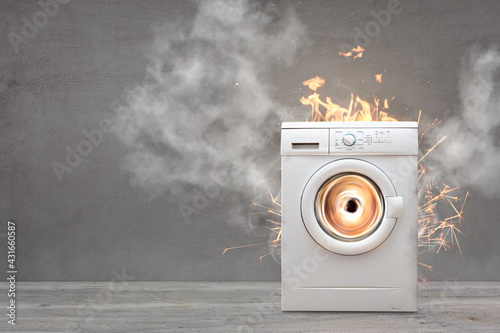 Broken Washing Machine With Smoke And Fire photo