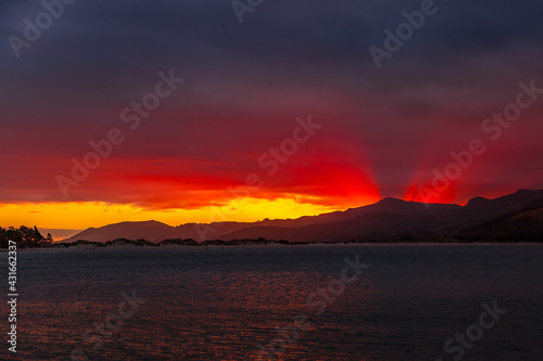 Sunset over Pilot Bay in New Zealand © philipbird123