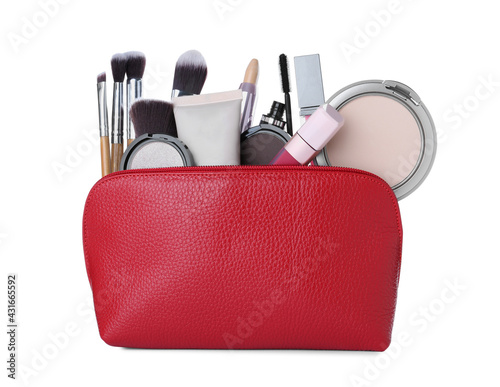 Different luxury decorative cosmetics and brushes in red case on white background