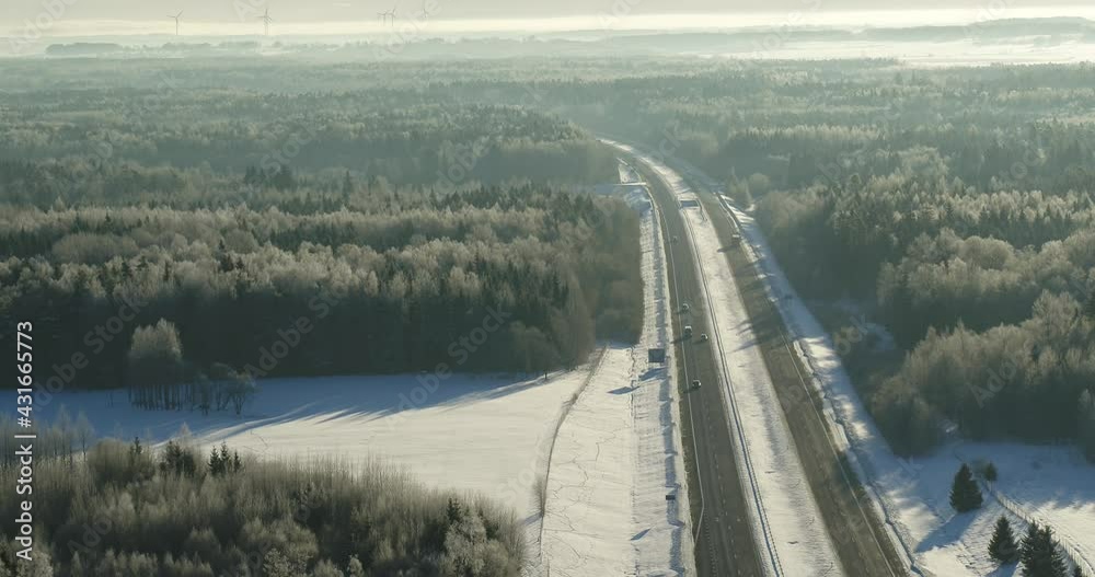 Birds eye view of highway in cold winter day. Lithuania landscape Birds eye view of highway in cold winter day. Lithuania landscape