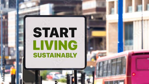 Start Living Sustainably sign in a busy city centre
