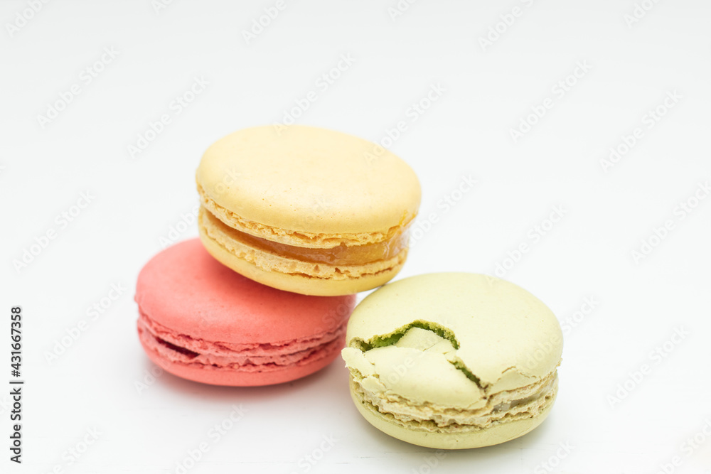Multicolored macaroon in white table Multicolored macaroon in white table