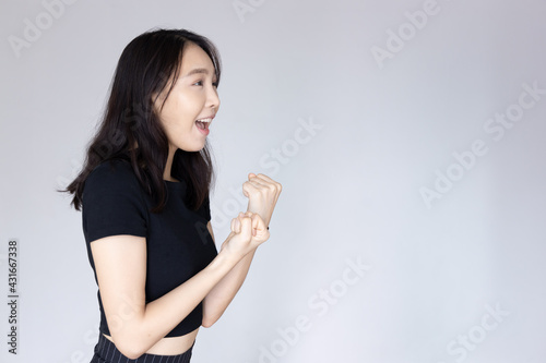 excited asian woman looking with surprise