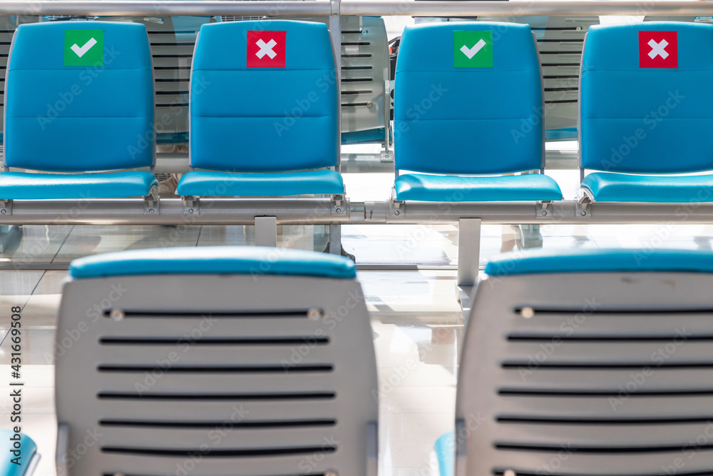 Social distancing chairs in airport during coronavirus or covid-19 virus outbreak a new normal concept. Social distancing chairs in airport during coronavirus or covid-19 virus outbreak a new normal concept.