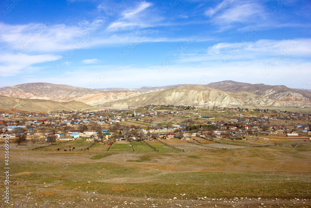 Obraz premium A small village among the beautiful Gobustan mountains. Azerbaijan.