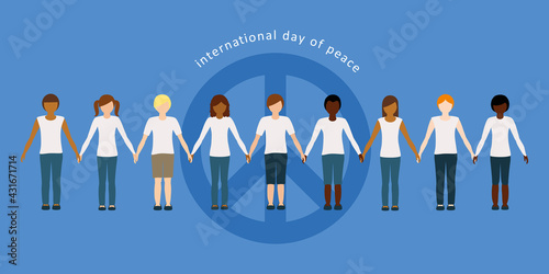 children of different skin color hold each other's hands on international day of peace