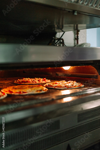 Pizza Into The Oven