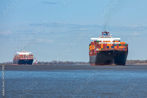 Two very large container ships on Elbe river