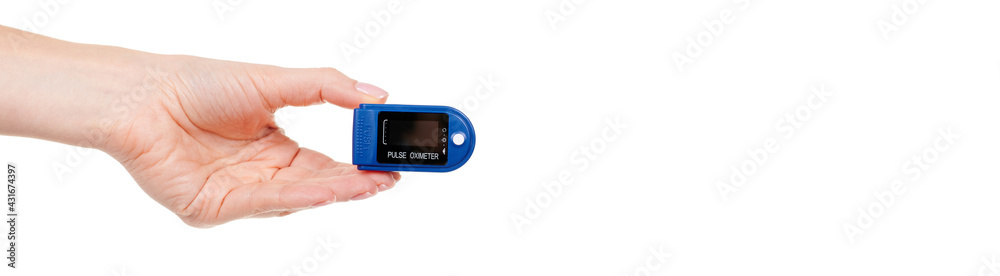 Hand with medical oximeter isolated on white background. Hand with medical oximeter isolated on white background.