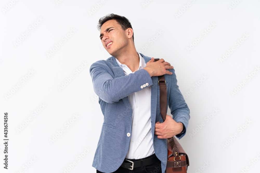 Young handsome businessman on isolated background suffering from pain in shoulder for having made an effort Young handsome businessman on isolated background suffering from pain in shoulder for having made an effort