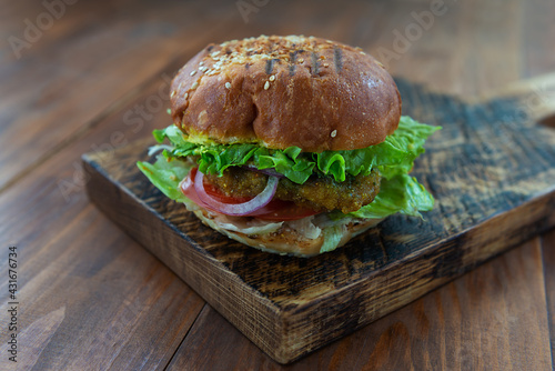 Vegan burger on a wooden board.
