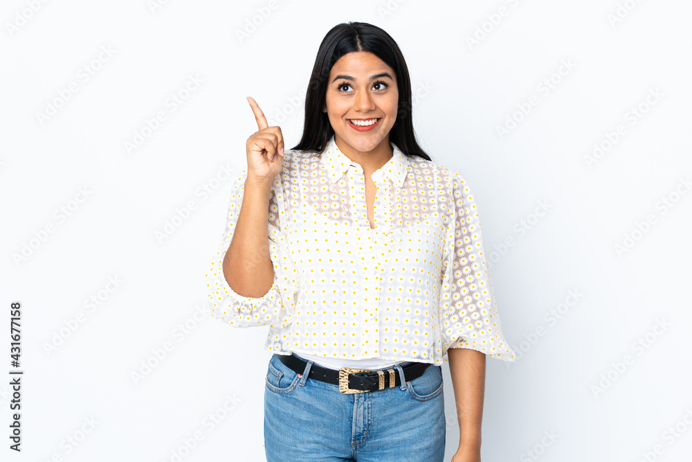 Young latin woman woman isolated on white background intending to realizes the solution while lifting a finger up Young latin woman woman isolated on white background intending to realizes the solution while lifting a finger up