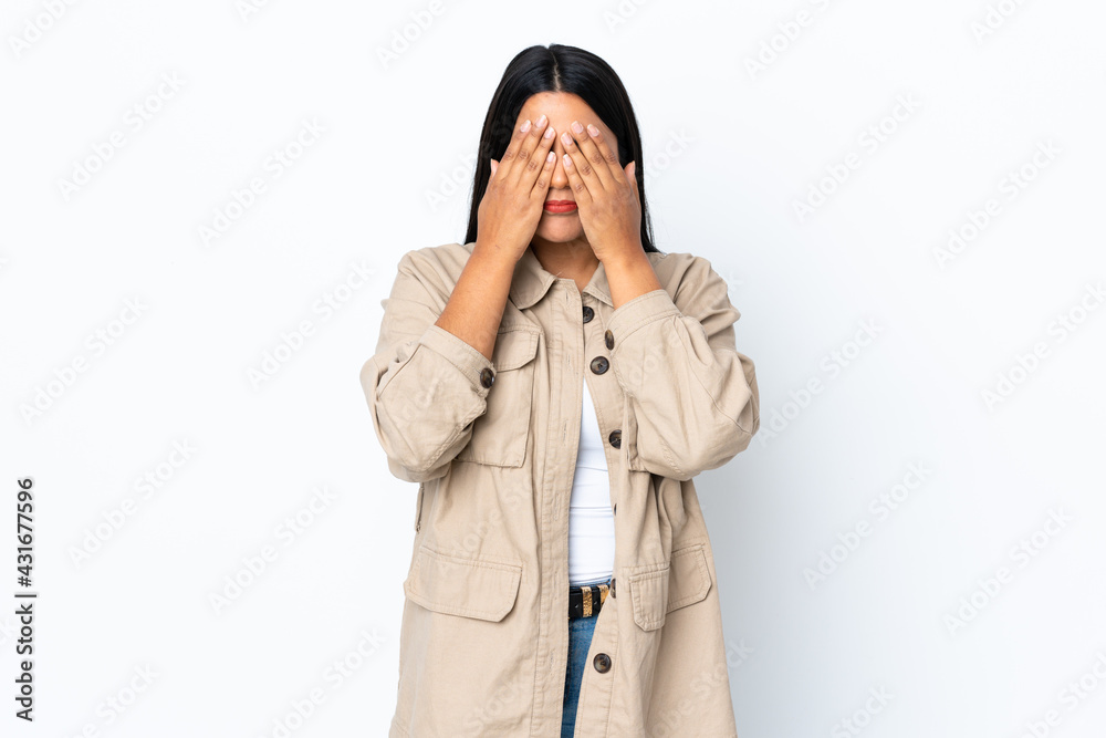 Young latin woman woman isolated on white background covering eyes by hands Young latin woman woman isolated on white background covering eyes by hands