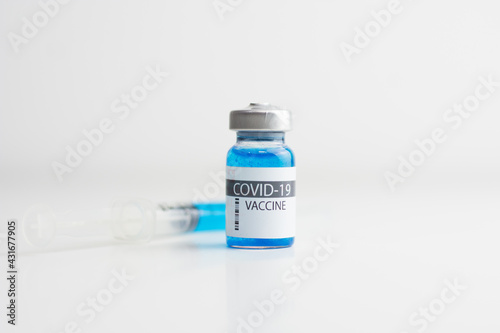 Coronavirus vaccine bottle with sryinge.Vaccination covid-19, medical research and development concept. photo