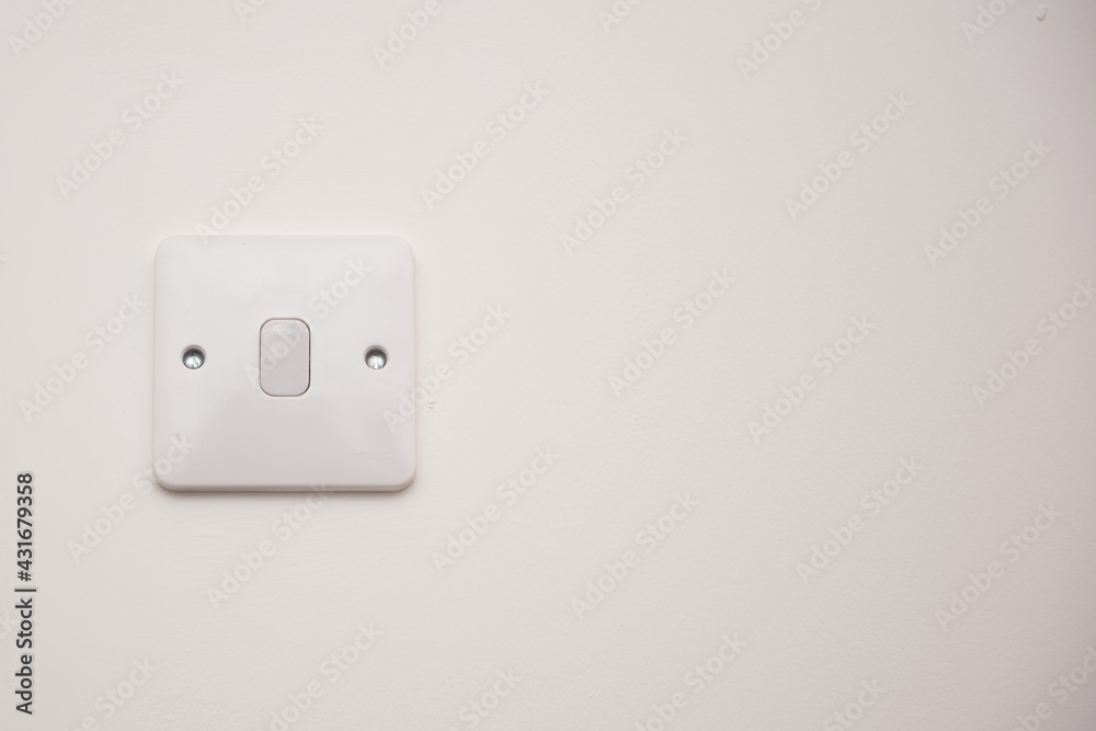 Light switch on a white wall Light switch on a white wall