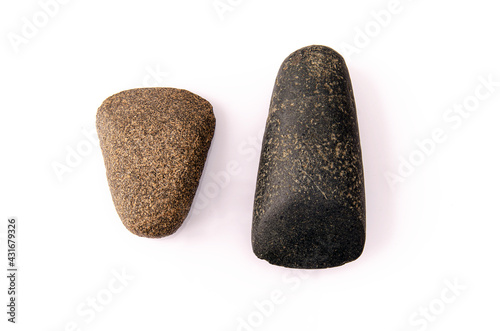 two Neolithic stone age bush-hammered axes. From the Acheulean culture. It is a basalt material hand tool whose technique was striking and cutting function, located in the Sahara desert. White backgro