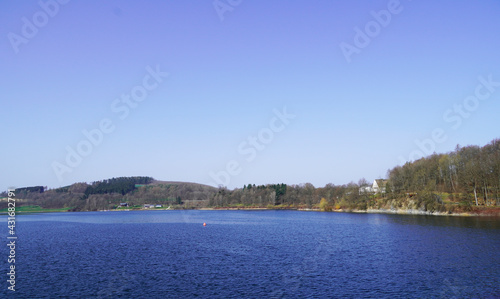 Landscape view of the Hennesee in Meschede and the surrounding nature. View of the lake from the barrier wall.