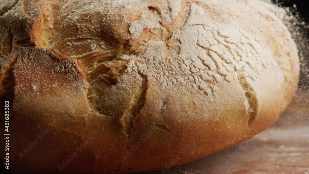 Close up shot of freshly baked bread falling in slow motion