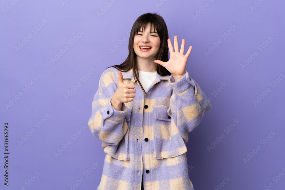 Young Ukrainian woman isolated on purple background counting six with fingers Young Ukrainian woman isolated on purple background counting six with fingers