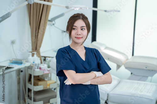 Portrait of cosmetologist standing in beauty salon plastic surgery clinic.