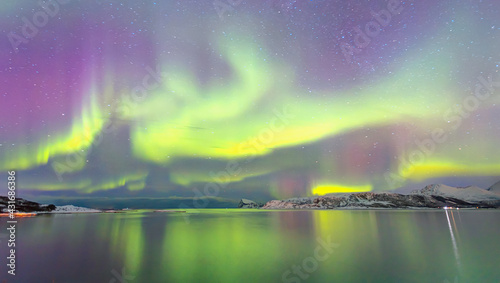 Northern lights or Aurora borealis in the sky over Tromso, Norway