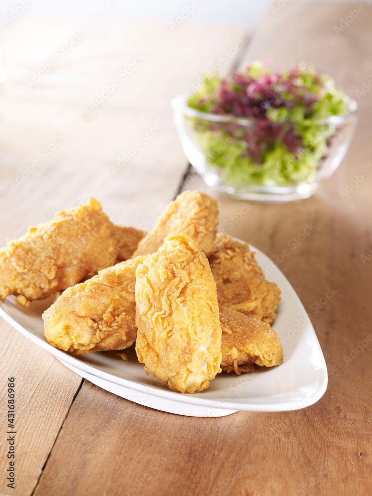 Crispy chicken wings and salad Crispy chicken wings and salad
