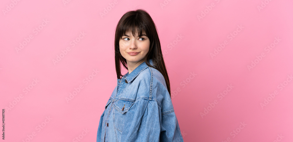 Young Ukrainian woman isolated on pink background . Portrait Young Ukrainian woman isolated on pink background . Portrait