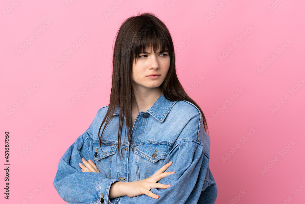 Young Ukrainian woman isolated on pink background keeping the arms crossed Young Ukrainian woman isolated on pink background keeping the arms crossed
