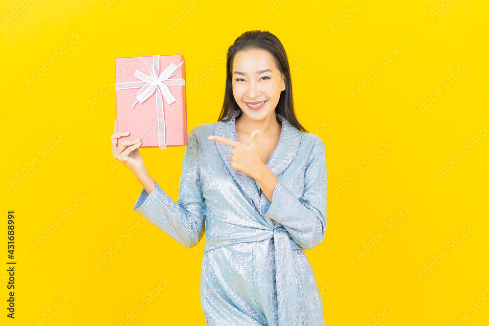 Portrait beautiful young asian woman smile with red gift box Portrait beautiful young asian woman smile with red gift box