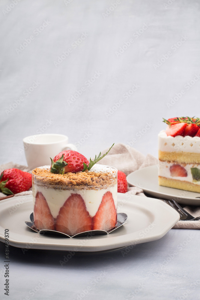 Fresh strawberry cake with cream in close up.