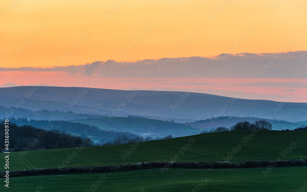 Sunset over Totnes fields, Berry Pomeroy Village, Devon, England, Europe