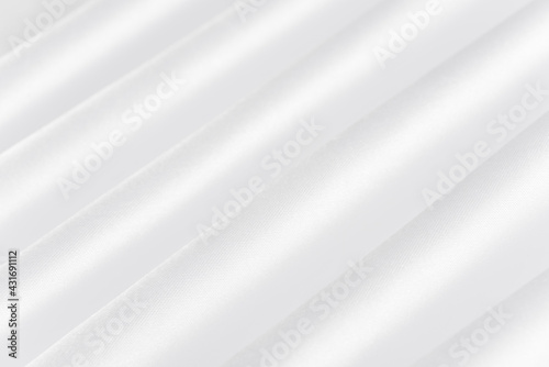 Abstract white silk fabric texture background. Cloth soft wave. Creases of satin