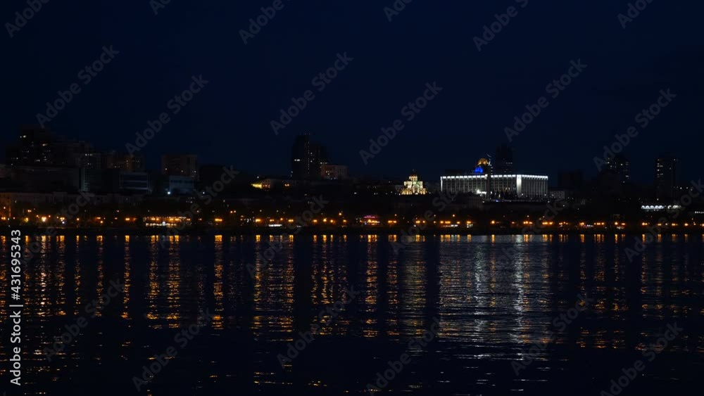 Samara city, Russia. May 2, 2021. Night view from Volga River on Ladja boat monument and beautiful Orthodox Church. One of largest Russian cities. historical centre of town. Night life view. 4 k video