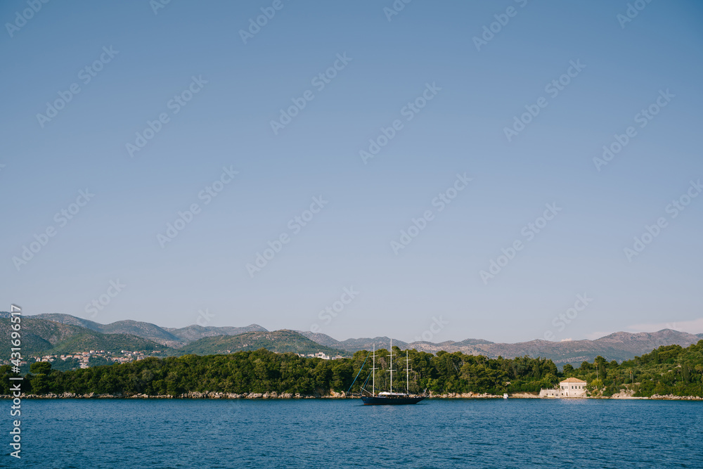 Three-masted wooden yacht off the Croatian islands.