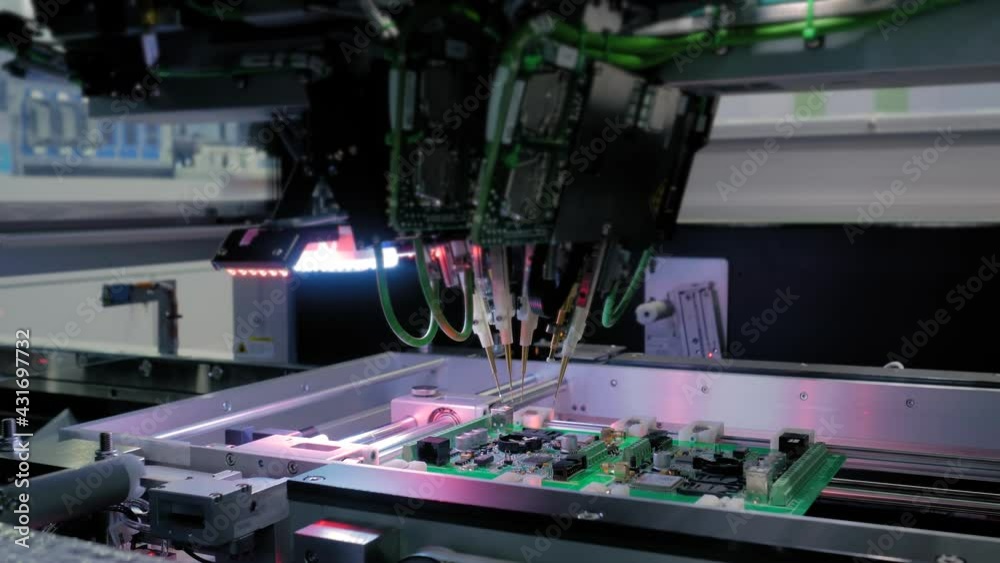 Automation machine equipment for quality testing of printed circuit boards - flying probe test at factory. Automated technology, industrial, robotic, electronic, production, manufacturing concept Automation machine equipment for quality testing of printed circuit boards - flying probe test at factory. Automated technology, industrial, robotic, electronic, production, manufacturing concept