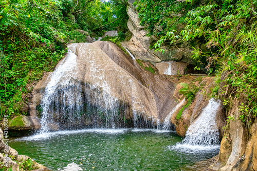 Waterfall in Hanabanilla, Villa Clara, Cuba. The place is named 'El Salto del Hanabanilla' photo