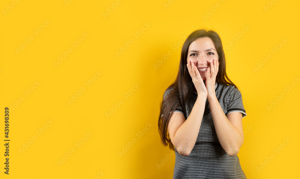Portrait of a modest young girl, on a yellow background Portrait of a modest young girl, on a yellow background