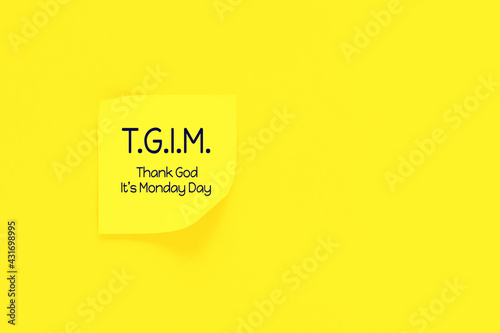 TGIM concept. Small ticker with traditional holiday text on sunny yellow background.Thank god it's monday day. Copy space. photo