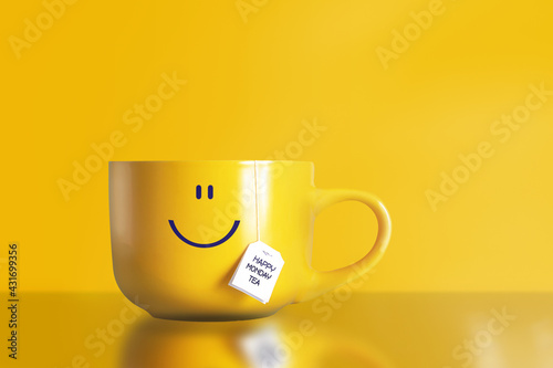 Thank god it's monday happy tea with happy face on big yellow cup on yellow background. The most happiest and motivation day of the year. No blue monday concept. Copy space.