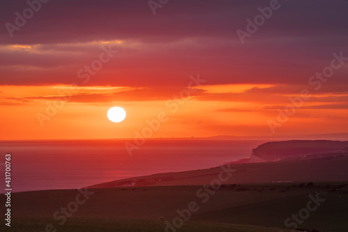 April sunset out to sea from Beachy Head on the South Downs East Sussex
