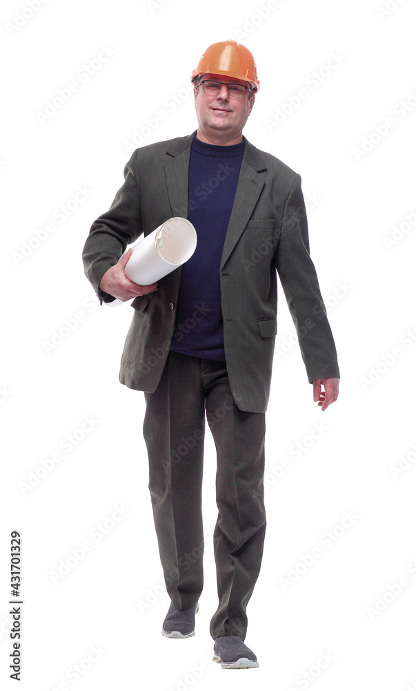 in full growth. male architect with a roll of sketches striding towards you. in full growth. male architect with a roll of sketches striding towards you.